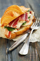 Image showing Sandwich with ham, brie cheese and salad.