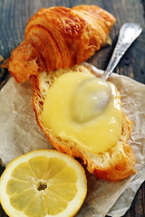 Image showing Croissant with cream and lemon.