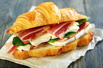 Image showing Croissant with ham and brie cheese.