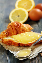 Image showing Lemon curd on a slice of fresh croissant.  
