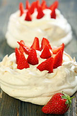 Image showing Pavlova dessert with strawberries and lemon cream.