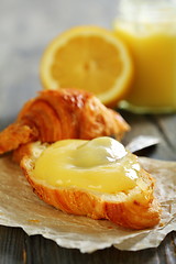 Image showing Fresh croissant with lemon curd.