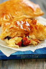 Image showing Patties with cheese, sun-dried tomatoes and basil.