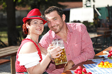 Image showing Couple in traditional costume in a beer garden