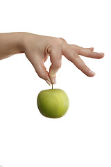 Image showing Female hand holding a green apple