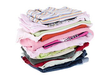 Image showing Pile of baby clothes isolated on white 
