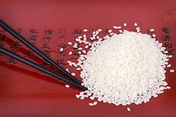 Image showing Rice and chopsticks on a plate