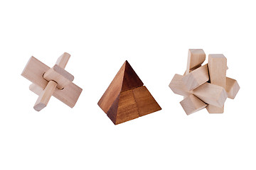 Image showing Wooden brain teasers on white background 