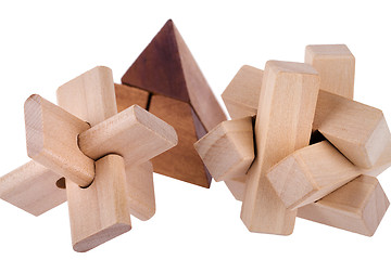 Image showing Wooden brain teasers on white background 