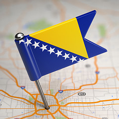 Image showing Bosnia and Herzegovina Small Flag on a Map Background.