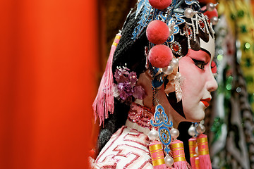 Image showing chinese opera dummy and red cloth as text space ,it is a toy,not