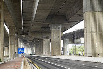 Image showing Empty asphalt road under the new expressway line. 