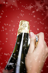 Image showing Opening champagne bottle