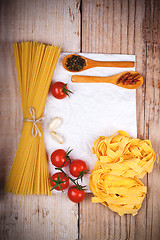 Image showing uncooked pasta with tomatoes and spices