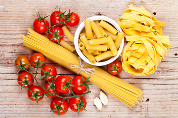 Image showing uncooked pasta with tomatoes