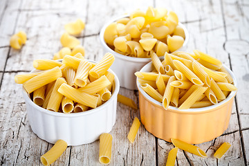 Image showing uncooked pasta in three bowls 