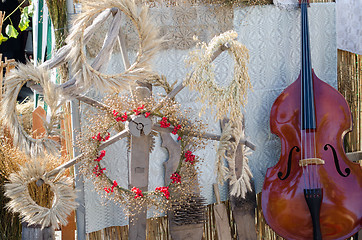 Image showing dried oats rye berry wreath composition near bass 