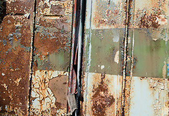 Image showing close up of old rusty metal bus door background 