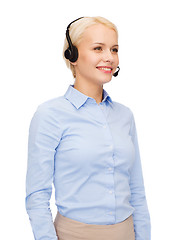 Image showing friendly female helpline operator with headphones