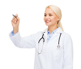 Image showing female doctor working with something imaginary