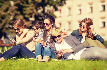 Image showing students looking at smartphones and tablet pc