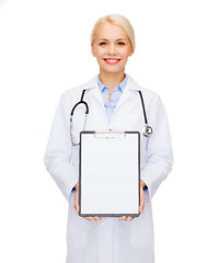 Image showing smiling female doctor with clipboard