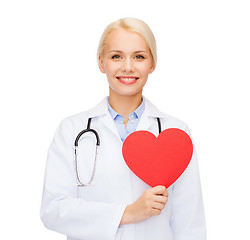 Image showing smiling female doctor with heart and stethoscope