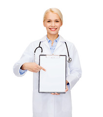 Image showing smiling female doctor with clipboard