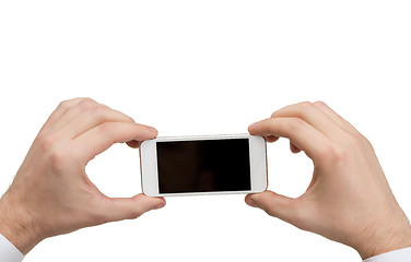 Image showing close up of man hands holding smartphone