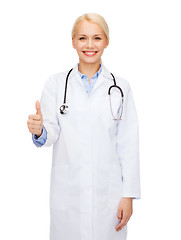 Image showing smiling female doctor showing thumbs up