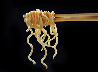 Image showing Chopsticks with noodles