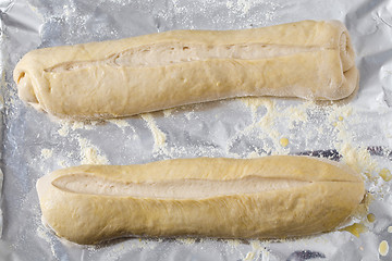 Image showing Bread dough batons rising