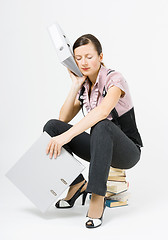 Image showing tired woman sleeps sitting on books