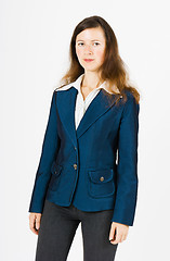 Image showing serious woman in blue jacket standing