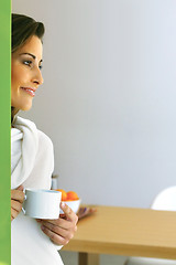 Image showing Relaxed woman in modern kitchen