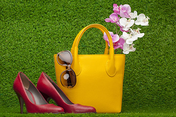 Image showing sunglasses, handbag; and red shoes