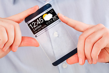 Image showing Smartphone with transparent screen in human hands.