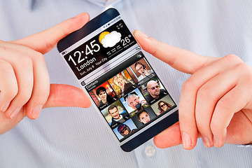 Image showing Smartphone with transparent screen in human hands.