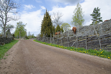 Image showing Along an old fashioned road