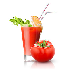 Image showing red tomato and glass of juice isolated on white