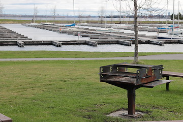 Image showing Barbecue with Boat slips in the background