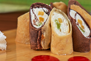 Image showing pancake roll with marmalade