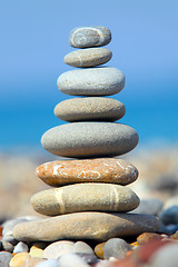 Image showing Stones over blue sky and sea