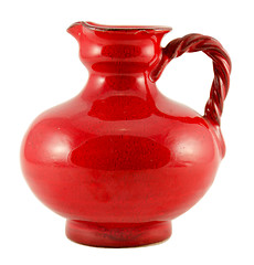 Image showing red ceramic old jug with handle isolated on white  