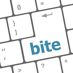 Image showing bite enter button on computer pc keyboard key