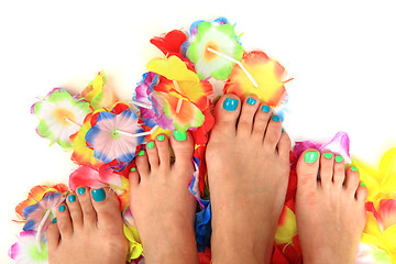 Image showing women feets and flowers (pedicure tbackground)