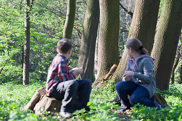 Image showing Squirrel and two children at park