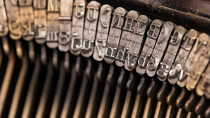 Image showing Close-up of an old retro typewriter with paper