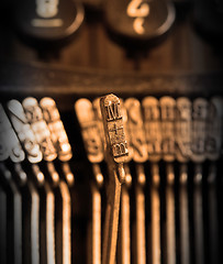 Image showing Close-up of an old retro typewriter with paper