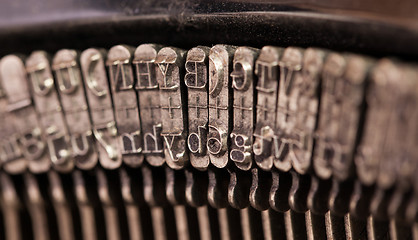 Image showing Close-up of an old retro typewriter with paper